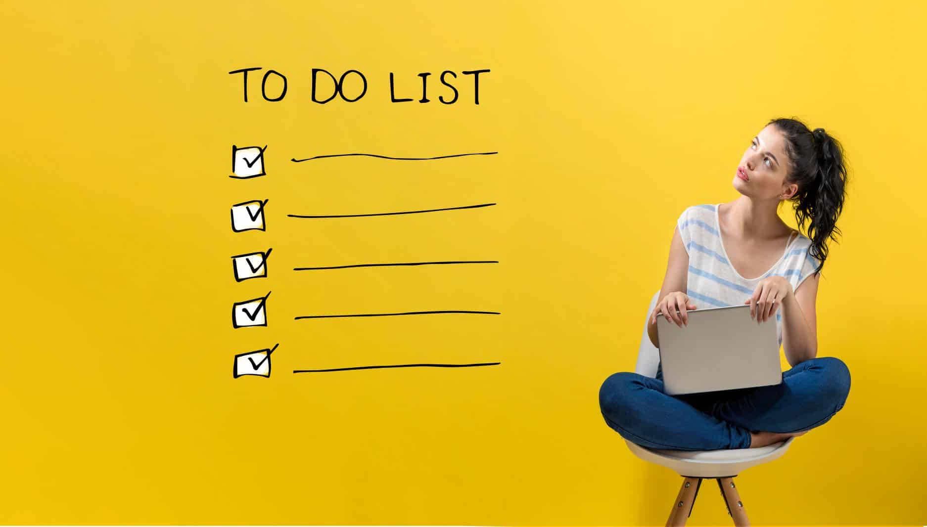 woman looking at to do list on a yellow wall